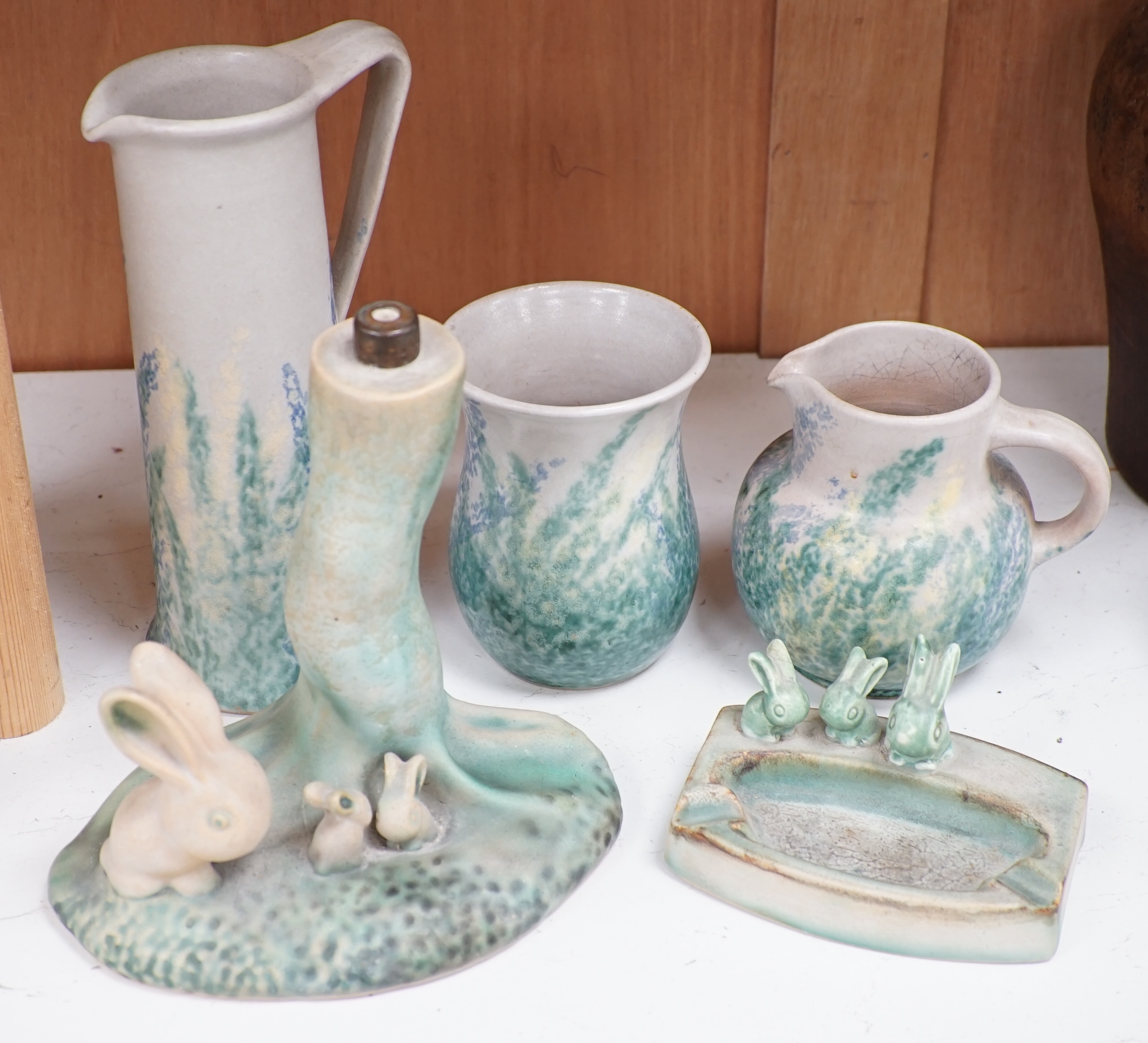 A 'rabbit and tree' Denby Ware pottery table lamp, a similar rabbit ashtray, two jugs and a vase, tallest 25cm (5). Condition - mostly good